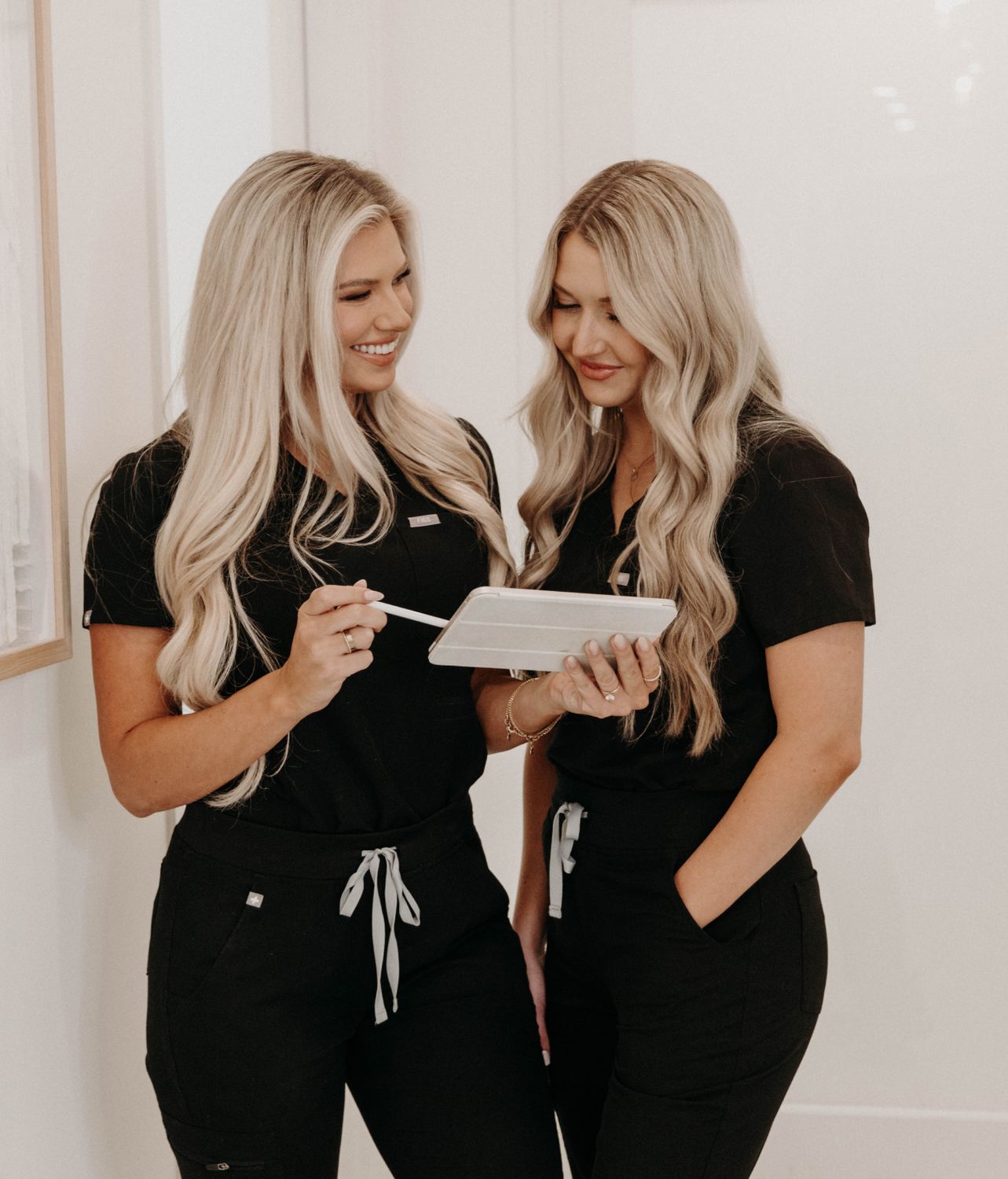 Two women reviewing information together.
