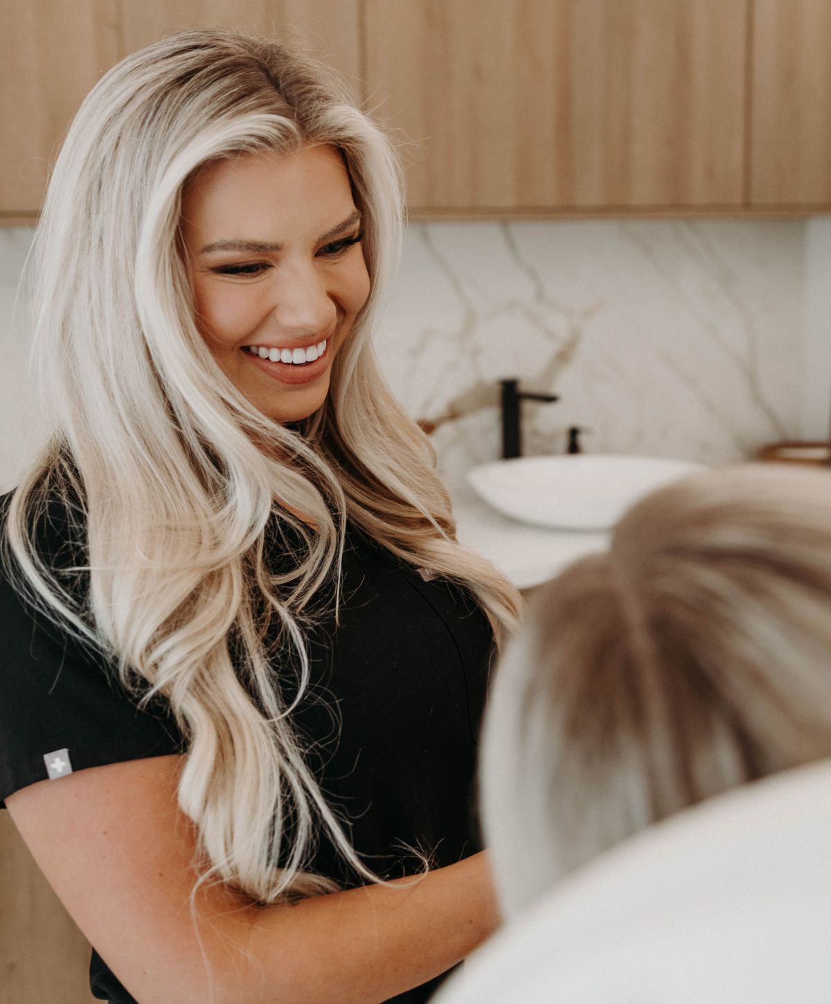 Smiling professional interacting with a client.